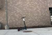 Photo of a bird scooter outside of Alex Manoogian Hall