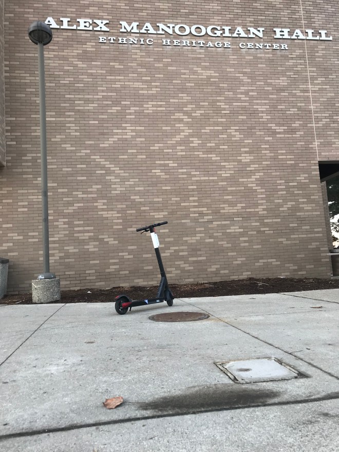 Photo of a bird scooter outside of Alex Manoogian Hall