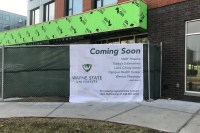 Photo taken of the incomplete exterior of the Wayne Anthony Drive Apartments, Coming soon 1000 degrees pizzeria, tubby's submarines, Leo's Coney Island, Compus health center, warrior pharmacy and more!