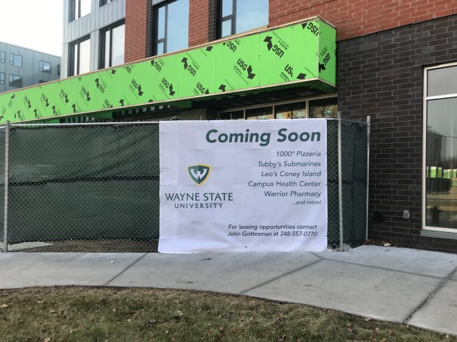 Photo taken of the incomplete exterior of the Wayne Anthony Drive Apartments, Coming soon 1000 degrees pizzeria, tubby's submarines, Leo's Coney Island, Compus health center, warrior pharmacy and more!